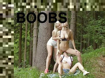 Three young girls have a threesome in the woods