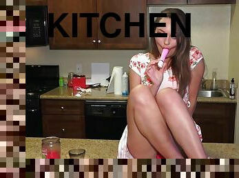 Teenie with small tits toys herself in the kitchen