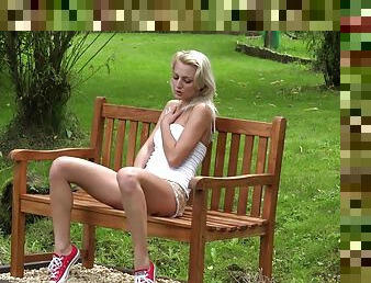 Skinny teen with small tits toys herself outdoors