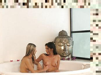 Young dark haired and blonde chicks make out in tub