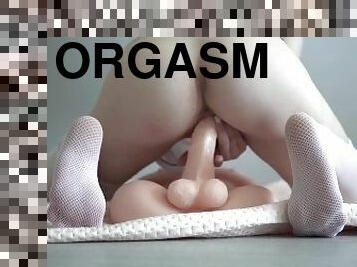 Greedily fucking a big rubber dick to orgasm