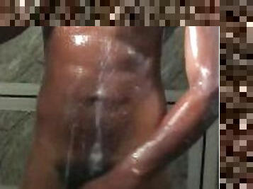 Black twink strokes his huge dick in the shower