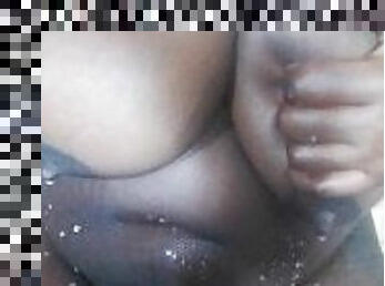 Kenyan milf with a lot of milk dripping out from her big sexy tits .