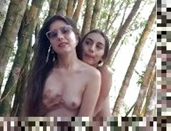 College girls masturbate outdoors in a public park and almost get caught.