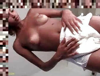 Naked black girl puts on a diaper