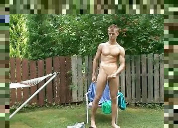 Twink cums in his hand in outdoor masturbation video