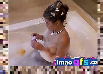 Hot Latina in the bath rubs her pussy and tits