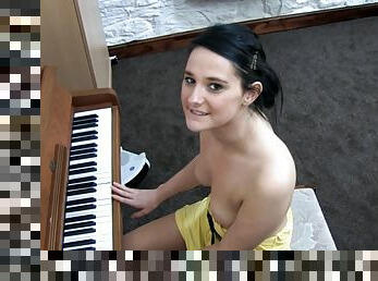 Awesome babe Elise is playing on piano