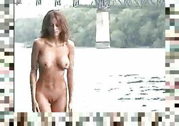 Dirty girl washes her nude body in the river