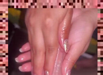 Babysitter gives gloryhole handjob with silver nails