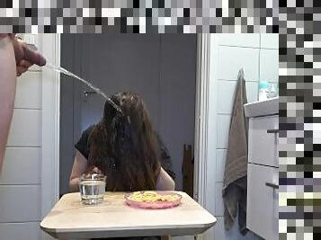 Golden shower on the amateur girl while she is having her breakfast