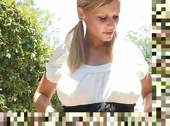 Blonde teen shows off her big natural tits in public