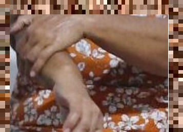 Mature woman rubs her hands rich