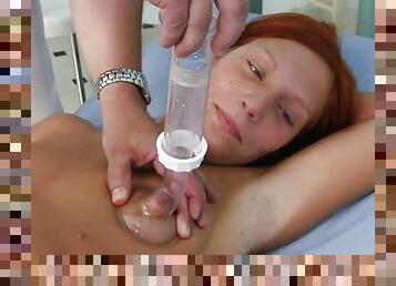 Sexy redhead stimulated by her doc