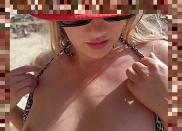 Topless hot milf on the public beach showing boobs