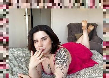 Sexy Tattooed Brunette Smokes