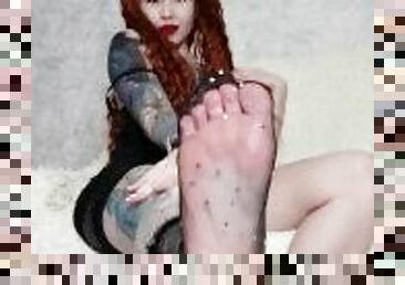 Foot fetish from a hot tattooed girl in a dress and socks