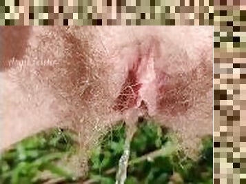 Amazing outdoor hairy pussy pissing filmed close up in slow motion