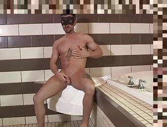 Str8 athlete in a mask jerks off his dick in the bathroom until he gets a cumshot