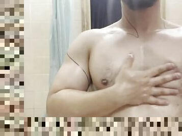 Sexy Bulking guy shows off his oiled muscle chest