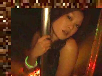 Amateur Asian bitch dances in a strip club.