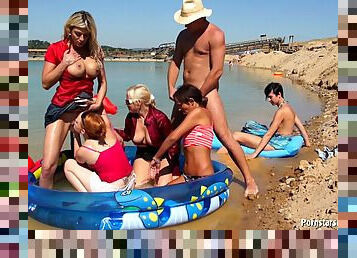Adventurous sluts stroke and share a lone cock right in the boat's orgy scene