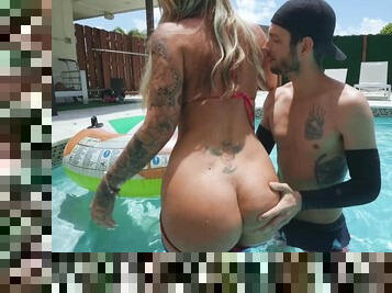 Inked MILF with thick lines grants younger pool boy the best fuck