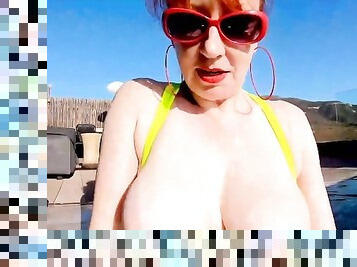 Red XXX fucks her pussy with a toy in the pool